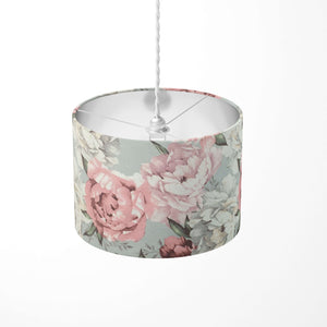 Pink large print floral patterned ceiling lampshade on a white background.