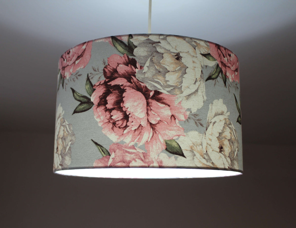 Floral patterned lampshade on a plain background.