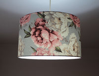 Floral patterned lampshade on a plain background.