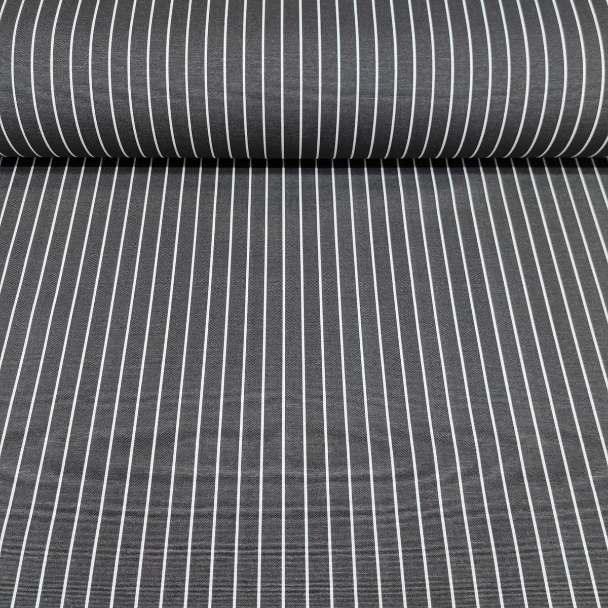 Roll of cotton upholstery fabric with dark grey and white pinstripe pattern