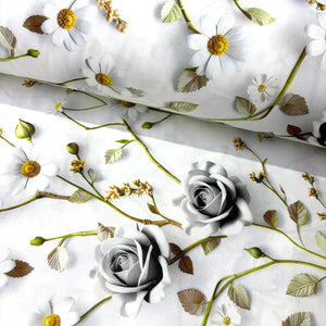 White cotton poplin fabric featuring realistic grey roses, white daisies and botanical foliage in a 3d floral print.