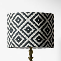 Table or floor lampshade with a black and white geometric southwestern pattern on a white background.