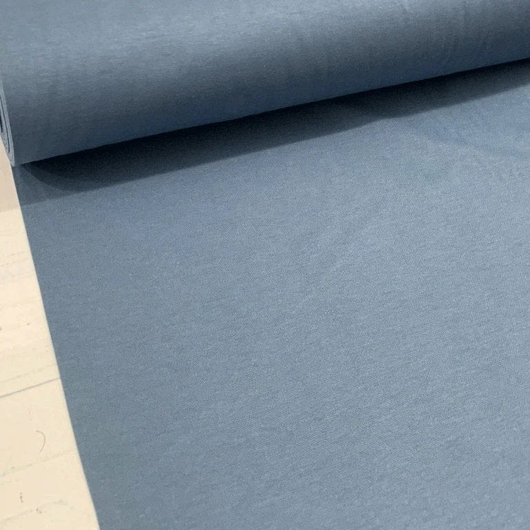 Indigo blue plain cotton canvas fabric in a steel blue shade, for upholstery, curtains, cushions, chairs and home décor projects.