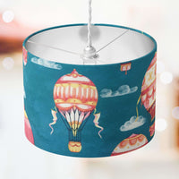 Lampshade with hot air balloon design on a blue background.