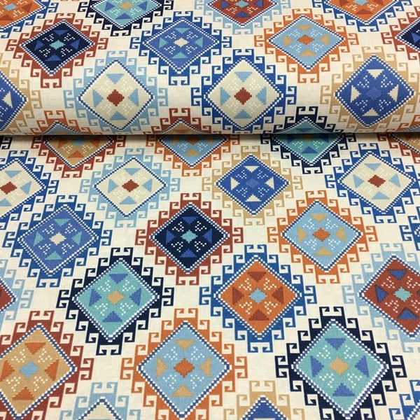 Patterned upholstery fabric with geometric design in blue, orange, brown and beige on a beige background.