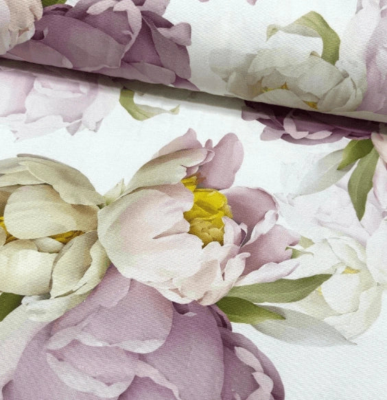 Lilac yellow large floral patterned upholstery fabric with pink and white flowers on a white background.
