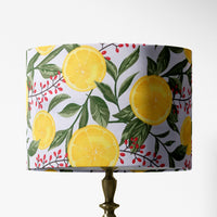Table lampshade with lemon tree pattern on a white background.