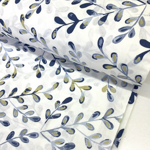 Blue and white cotton poplin fabric featuring a modern abstract leaf print in navy, grey and olive green, ideal for dressmaking, quilting and craft projects.