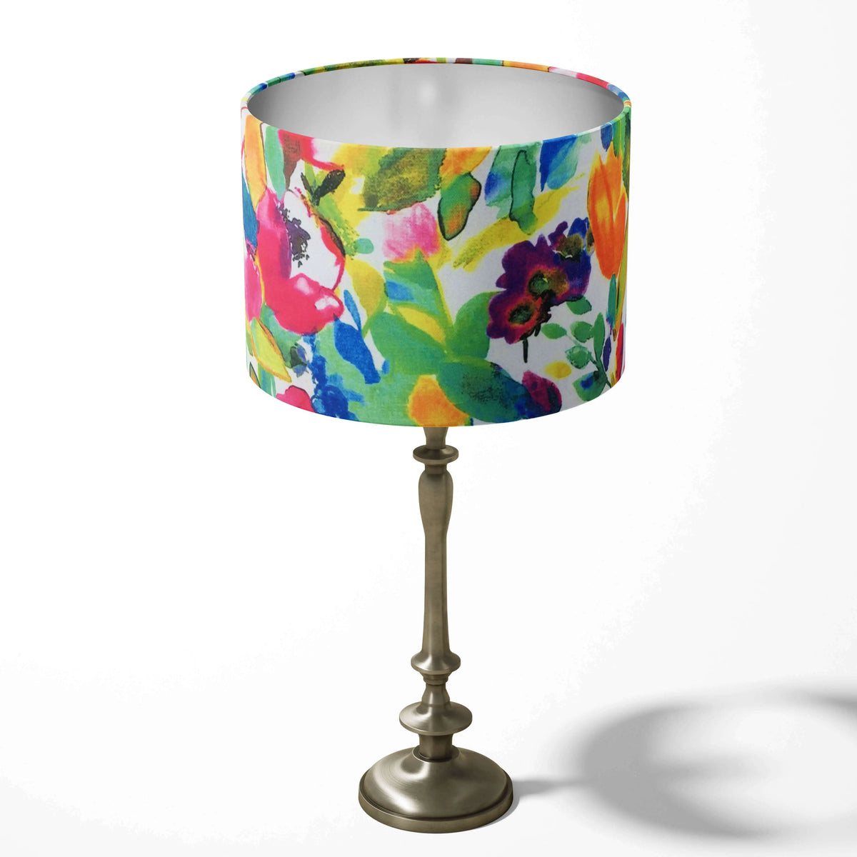 Table lampshade with a colourful flowers and leaves pattern on a white background.