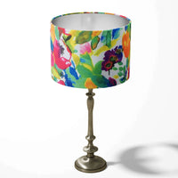 Table lampshade with a colourful flowers and leaves pattern on a white background.
