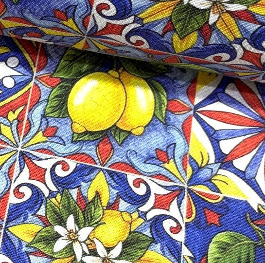 Lemon print mediterranean tile fabric in yellow, blue and red.