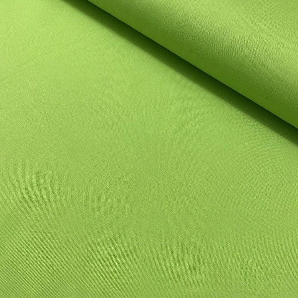 Bright lime green cotton canvas upholstery fabric ideal for curtains, cushions, drapes, upholstery and outdoor projects.