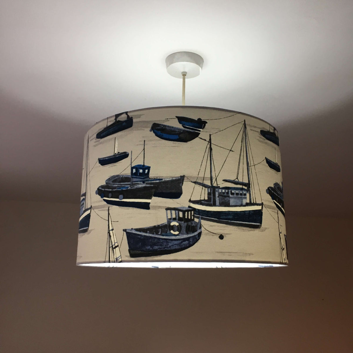 Navy blue and white maritime ceiling lampshade.