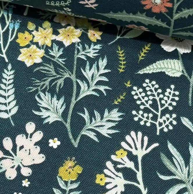 Forest green tapestry upholstery fabric designed with yellow red small flowers and sage green leaves.