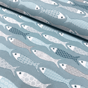 Patchwork design fish print fabric in mint green duck egg and white colours for upholstery curtain making and home decor.
