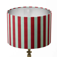 Thin stripe lampshade with red and white vertical stripes on a white background.