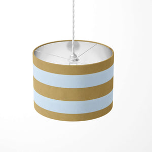 Mustard and white large horizontal stripe patterned ceiling lampshade on a wite background.