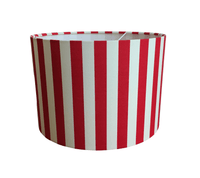 Bright red and white striped lampshade on a white background.