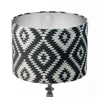 Monochrome lampshade with black and white southwestern diamond pattern on a white background.