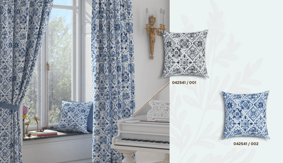 Decorative tile patterned blue and white cushions and curtains in a room with a window and piano.