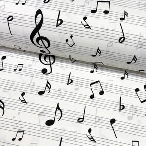 Music sheet fabric with black notes on a white background.