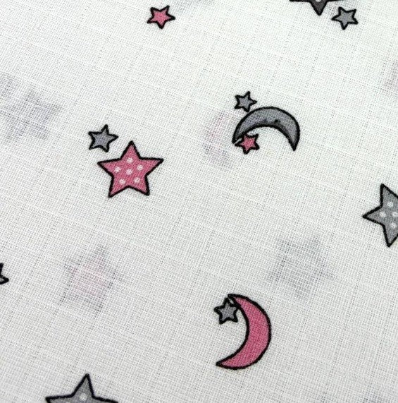 Cotton muslin double gauze fabric patterned with celestial pink and grey moons and stars on a white background.