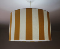 Mustard and white striped lampshade.