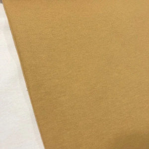 Mustard yellow cotton canvas fabric in a plain ochre yellow shade, suitable for upholstery, curtains, cushions, chairs and home decor.