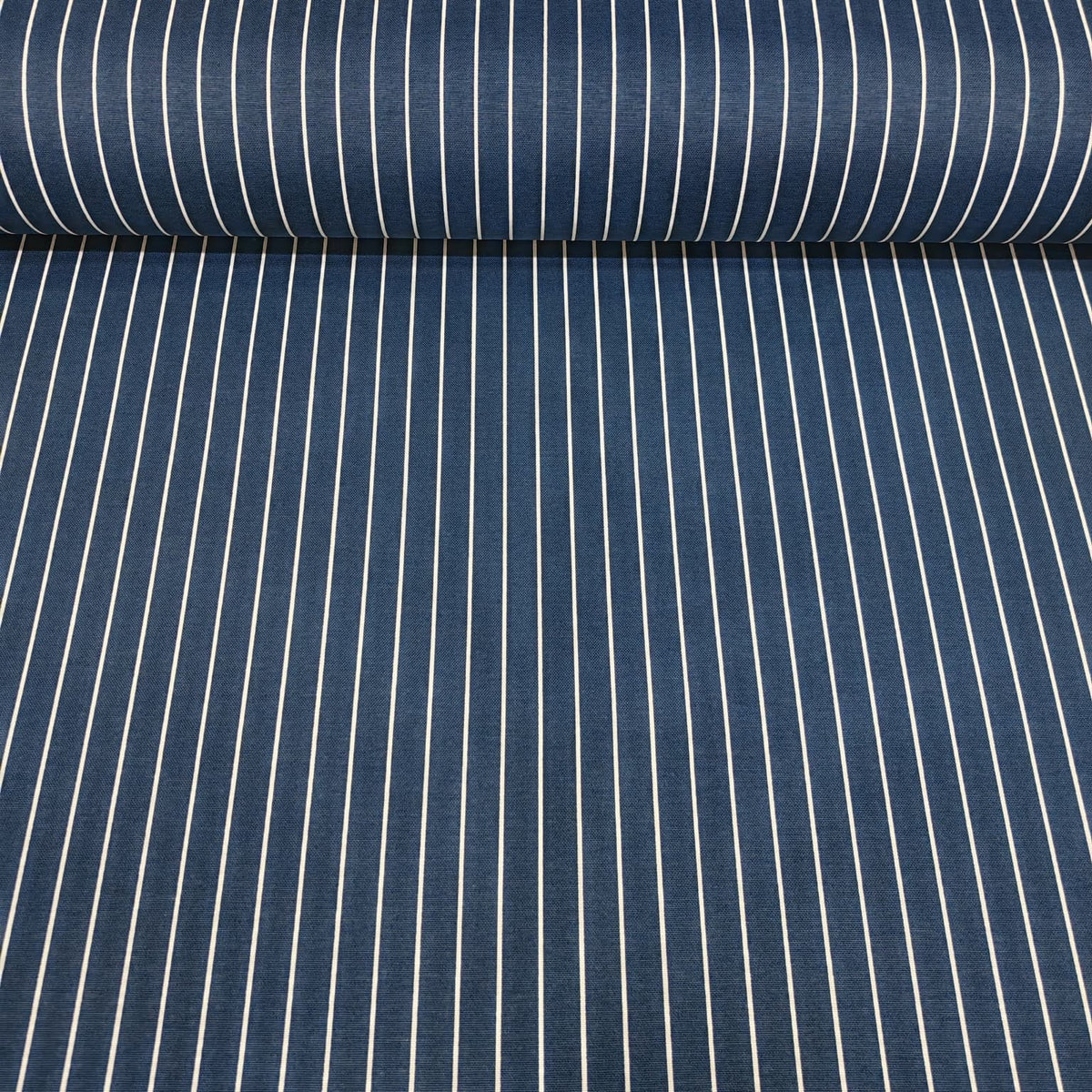 Roll of blue white vertical pinstripe cotton curtain fabric