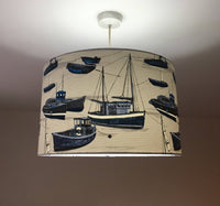 Ocean sailboat lampshade in blue and white.