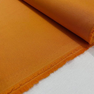 Orange cotton canvas fabric with a water-repellent feature, ideal for outdoor upholstery, cushions, curtains, bags and home décor projects.