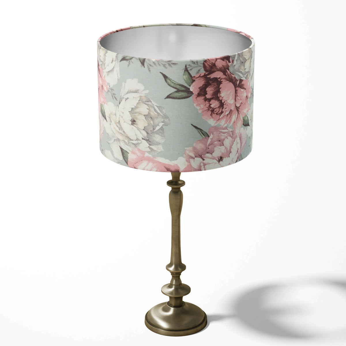 Grey table lampshade with pink and white peony flower pattern on a white background.