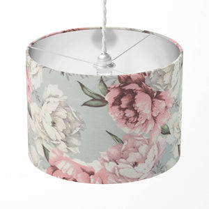 Decorative lampshade featuring pink and white peony flowers on grey on a white background.