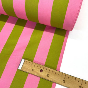 Roll of pink and green cotton striped fabric with a wooden ruler for scale.