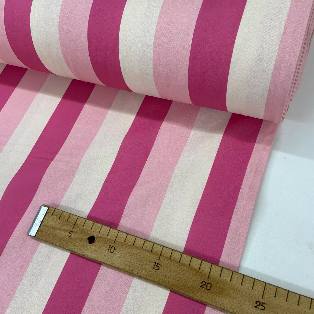 Pink stripe cotton fabric featuring wide hot pink, blush pink and white vertical cabana stripes.