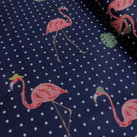 Upholstery & curtain fabric with pink flamingo and polka dot pattern on a navy blue background.