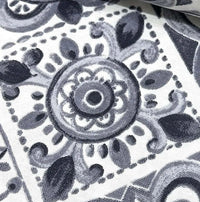 Close-up of grey moroccan tile fabric.