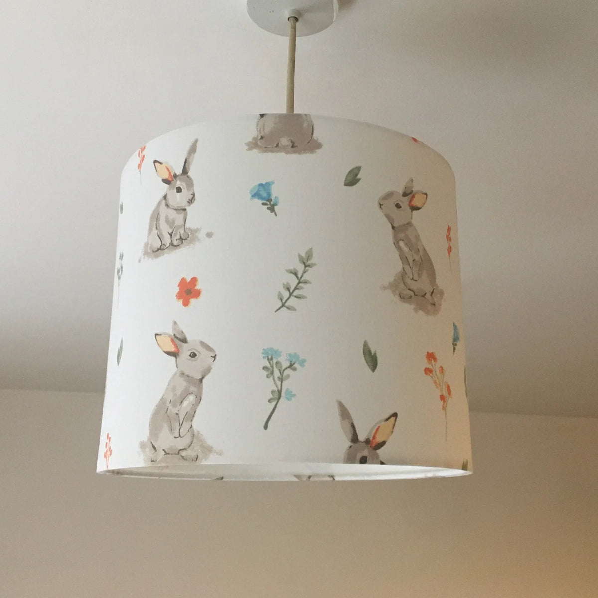 Woodland rabbit print ceiling lampshade in beige and white.