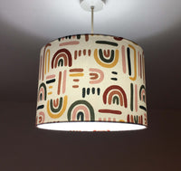 Rainbow patterned drum ceiling light shade.
