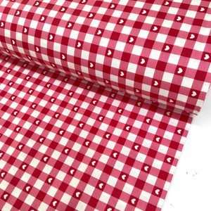 Red and white gingham 100% cotton fabric with small white heart print, ideal for quilting, sewing, dressmaking, patchwork, crafts and home décor.