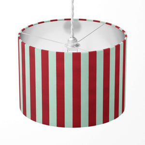 Striped lampshade with red and white vertical stripes on a white background.