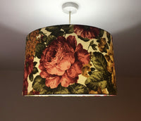 Floral patterned lampshade hanging from a ceiling light fixture.