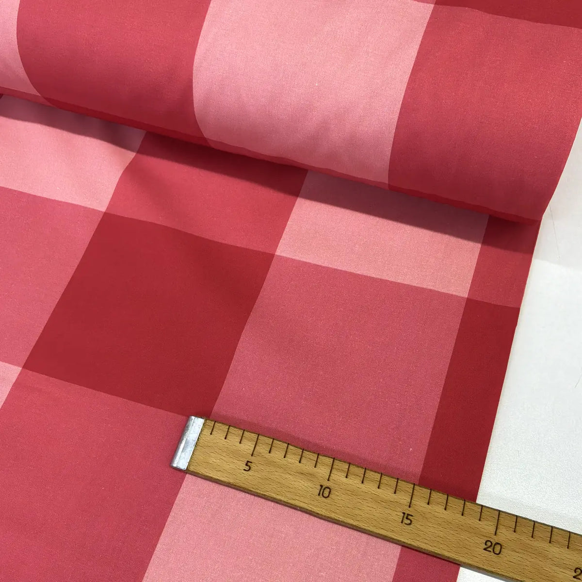 Red and pink large check gingham 100% cotton fabric with an oversized buffalo plaid pattern, ideal for quilting, sewing, patchwork, crafts, and home décor.