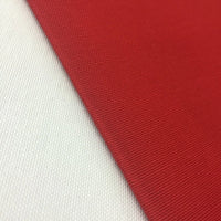Red water-resistant cotton canvas fabric suitable for upholstery, curtains, cushions, chair covers, bags and sewing projects.
