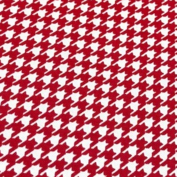 Houndstooth pattern cotton canvas fabric in red and white.