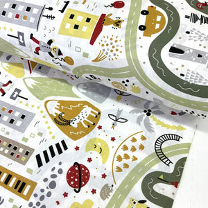 Children's road map fabric with colorful road and animal illustrations on a white background.