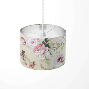 Pink white rose and sage green leaves patterned ceiling lampshade on a white background.