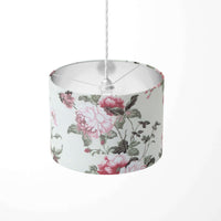 Pink roses patterned ceiling lampshade on a white background.