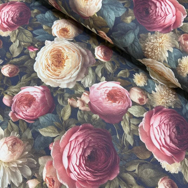 Roses upholstery fabric patterned with burgundy pink and white flowers on a deep blue background.