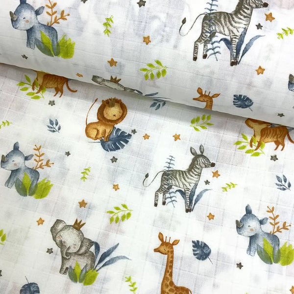 Baby fabric with safari animal pattern including zebras, elephants, lions and giraffes in mustard yellow and grey on a white background.